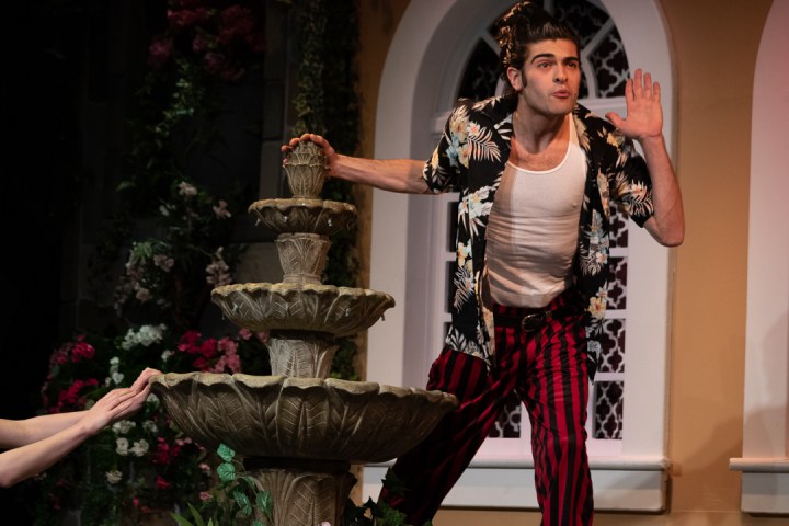 a person standing in front of a mirror posing for the camera