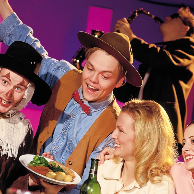 a couple of people that are eating some food