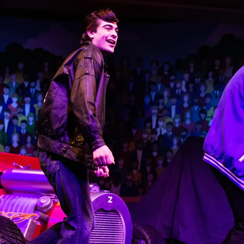 a person sitting on a stage