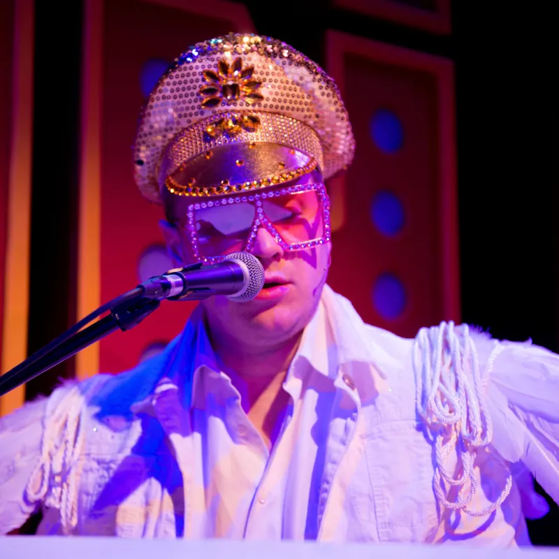 a person wearing a hat and glasses