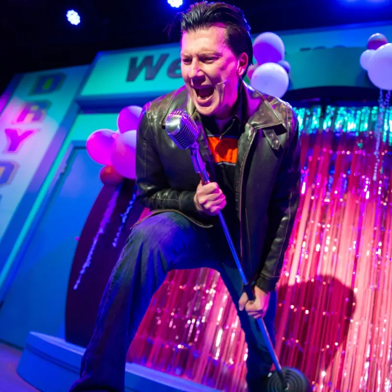 a person sitting on a stage